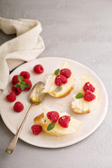 Open faced sandwiches with cheese, pears and raspberry