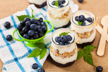 Healthy Greek Yogurt with Blueberries and Granola Parfait. Selective focus.