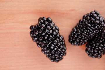 Isolated blackberry on a wooden close-up background