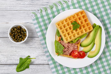 salted waffles sandwich with avocado, pate