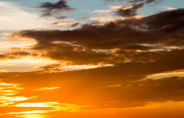 colorful dramatic sky with cloud at sunset.