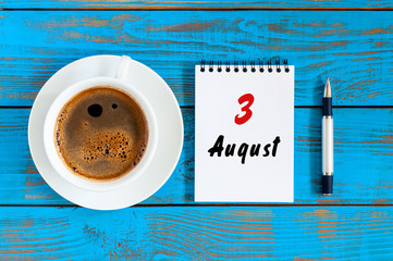 August 3rd. Day 3 of month, daily calendar on blue background with morning coffee cup. Summer time. Unique top view