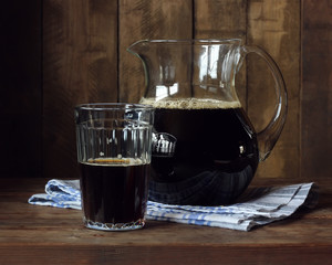 Beer or kvass. A pitcher with a dark drink.