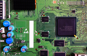 Electronic circuit board green color close-up. High-tech computer motherboard for tv.