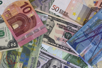 Obraz na płótnie Canvas Abstract dollar euro and swiss franc background.