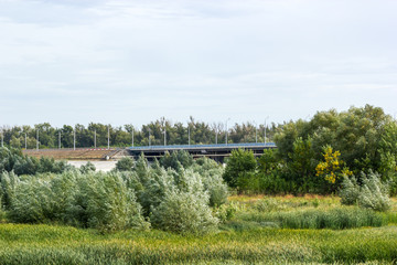 Fototapeta premium Road bridge passing through the field