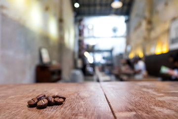 Coffee beans in glass on table