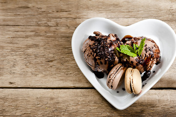 Delicious chocolate ice cream in a plate with a heart