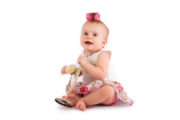 Cute baby girl makes a hair