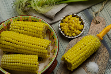 Boiled sweet corn served with salt and butter 