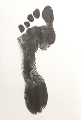 Human foot print on white background