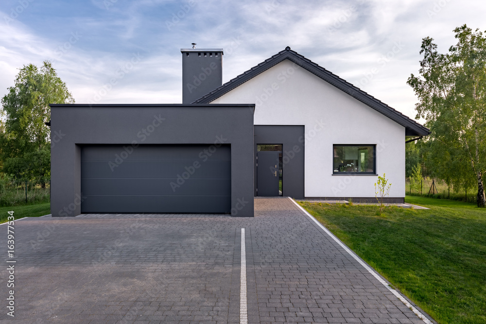 Wall mural Cozy house with garage