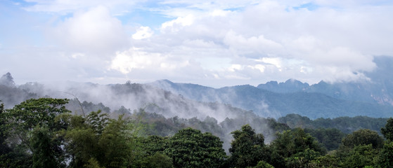 Obraz premium The beautiful scenery of mountains range view with cloud or mist