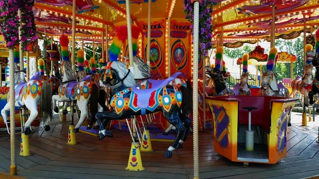 Working merry-go-round carousel in the amusement park. Nobody
