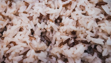 Closeup mix of steam jasmine rice and berry rice background select focus