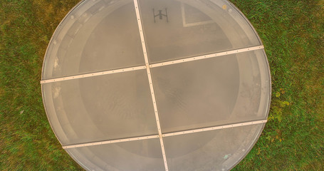 A drone reflection on a grass roof skylight 