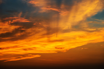 Sunset makes the sky and cloud  a beautiful golden yellow.