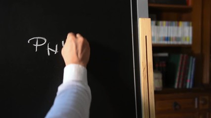 Physics subject lesson title writing on school blackboard
