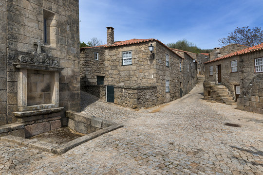 Old houses inside the wall of the castle of the historic village of Sortelha in Portugal; Concept for travel in Portugal