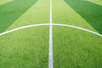 Obraz premium The white Line marking on the artificial green grass soccer field