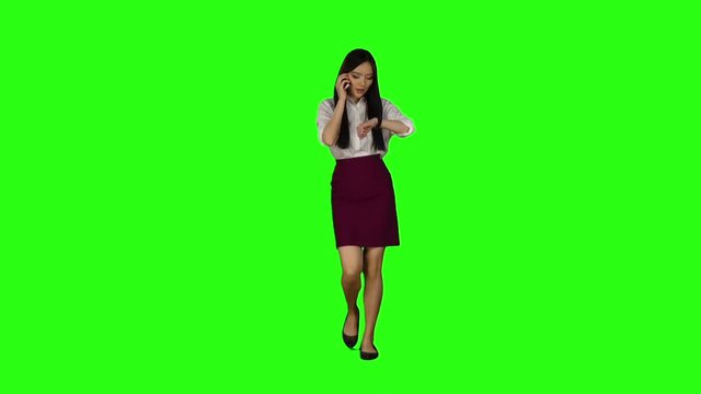 Girl goes to work, her phone rings, she starts to run. Green screen. Slow motion