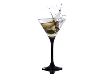 Cocktail martini with olive, a splash of vermouth in a glass