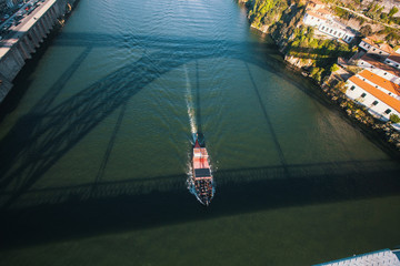 View of Douro river from Dom Luis I bridge with shadow on the water, Porto, Portugal..