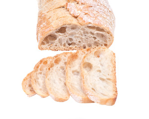 Sliced crusty ciabatta organic italian bread isolated on white background
