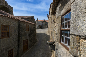 Fototapeta na wymiar Narrow cobblestone street in the historic village of Sortelha in Portugal; Concept for travel in Portugal