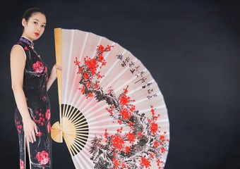Geisha and giant fan against navy chalkboard