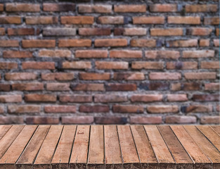 Wooden table on Brick wall 
