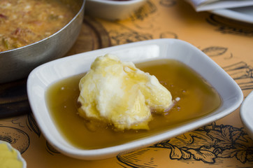 Traditional Turkish breakfast set: kaymak (butter cream), flatbre