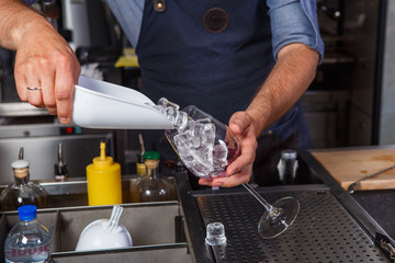 Barman at work, preparing cocktails. concept about service and beverages