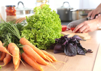 Cook's hands preparing vegetable salad - closeup shot