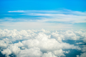Aerial view of Blue sky and top Cloud view or cloudy of bird eye view from airplane window.