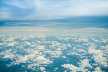 Fototapeta na wymiar Aerial view of Blue sky and top Cloud view or cloudy of bird eye view from airplane window.