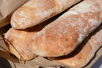 Loaves of ciabatta Italian slipper bread on display a farmer's market