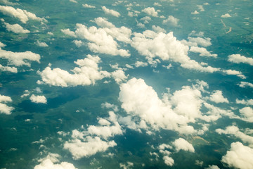 Aerial view of Blue sky and top Cloud view or cloudy of bird eye view from airplane window.