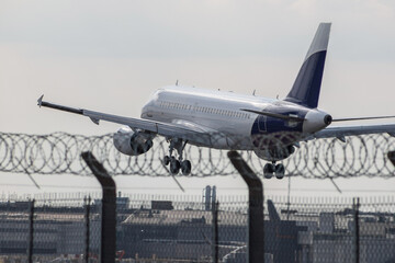 Passenger plane landing on the airport