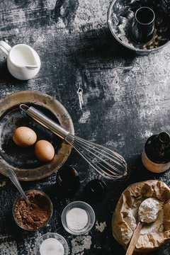 Some Of The Ingredients For Making An All Natural Red Velvet Bundt Cake - Roasted Beet Puree, Flour, Eggs, Cocoa Powder, Vanilla Extract, Baking Powder, And Salt. Buttermilk For The Glaze. A Flat Lay