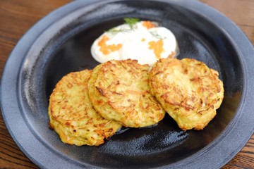Vegetable patties with sour cream and caviar 