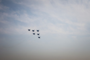 Team of  pilots russian knights do comlex aerobatic figure on su-27 and mig-29 in the sky