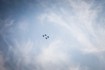 Team of  pilots russian knights do comlex aerobatic figure on su-27 and mig-29 in the sky