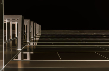 Abstract modern glass building. Looking up towards the sky with reflection from modern building arches. Modern architecture.