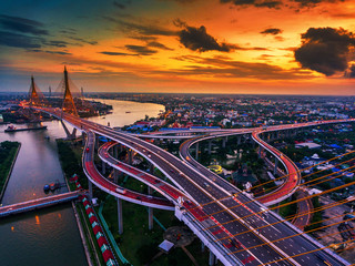 Road roundabout with car lots in Thailand.Bhumibol Bridge in Thailand.