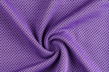 Neatly folded shiny purple fabric texture for design