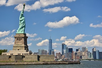 The Statue of Liberty and skyline of New York City. 