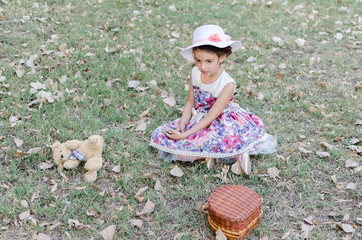 Obraz premium girl with toys and mobile