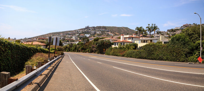 Blue sky over Pacific Coast Highway road heading into Laguna Beach