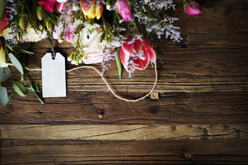 Various Fresh Flowers with Blank Design Space on Wooden Background